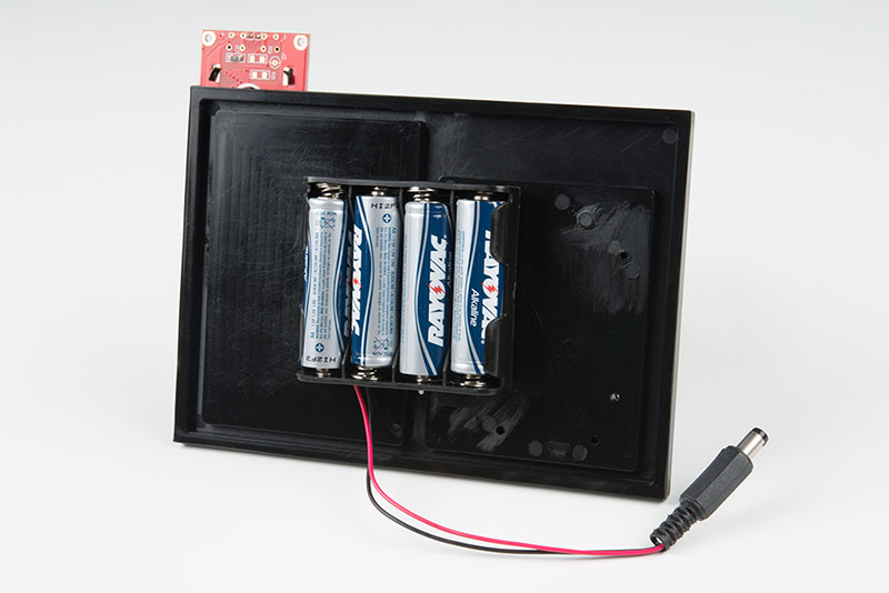 Insert the batteries into the holder