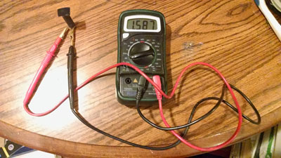 ohmmeter displays a value of 1.587 megaohms