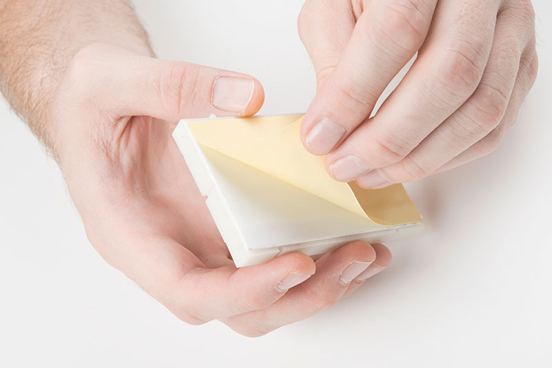 Peel the adhesive backing off the breadboard