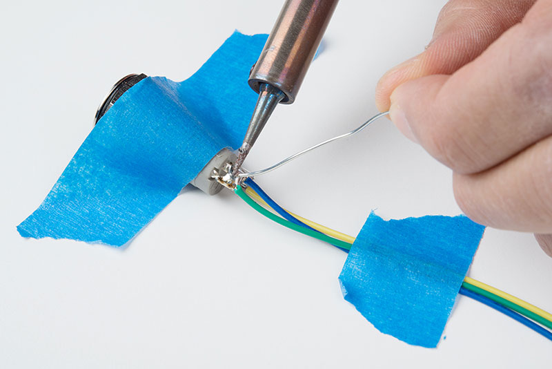 Solder jumper added between &ldquo;-&rdquo; and COM1 pin
