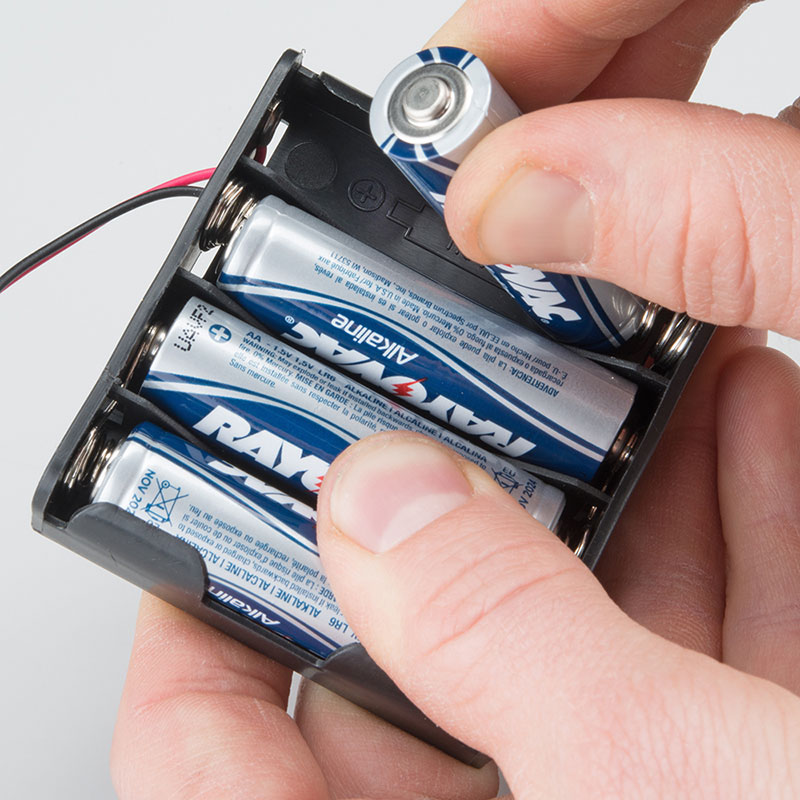 Press battery holder to baseplate/Dual Lock connects